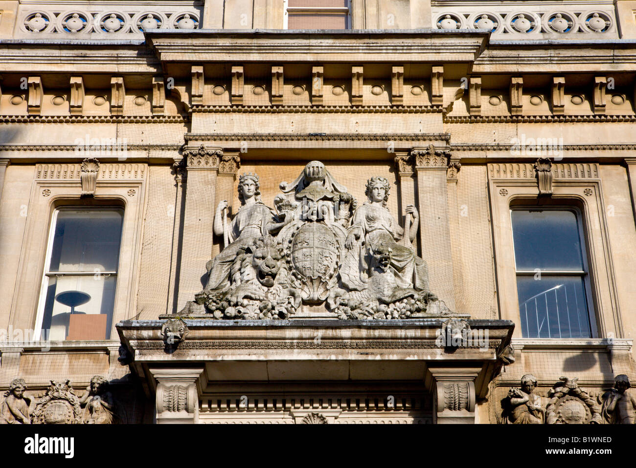 Elaborate sculpture adorning an old bank building in Southampton Hampshire England Stock Photo