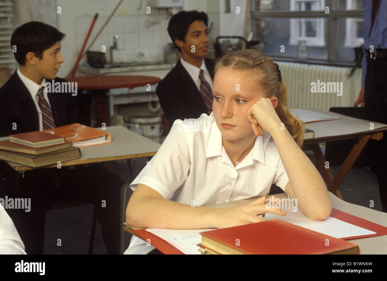 teenage girl looking vacant in class Stock Photo