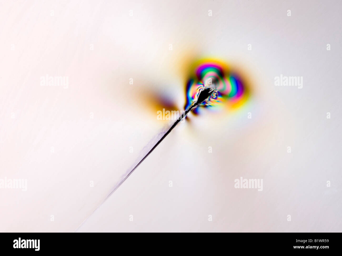 stress patterns around a crack in an acrylic plastic plastic sheet