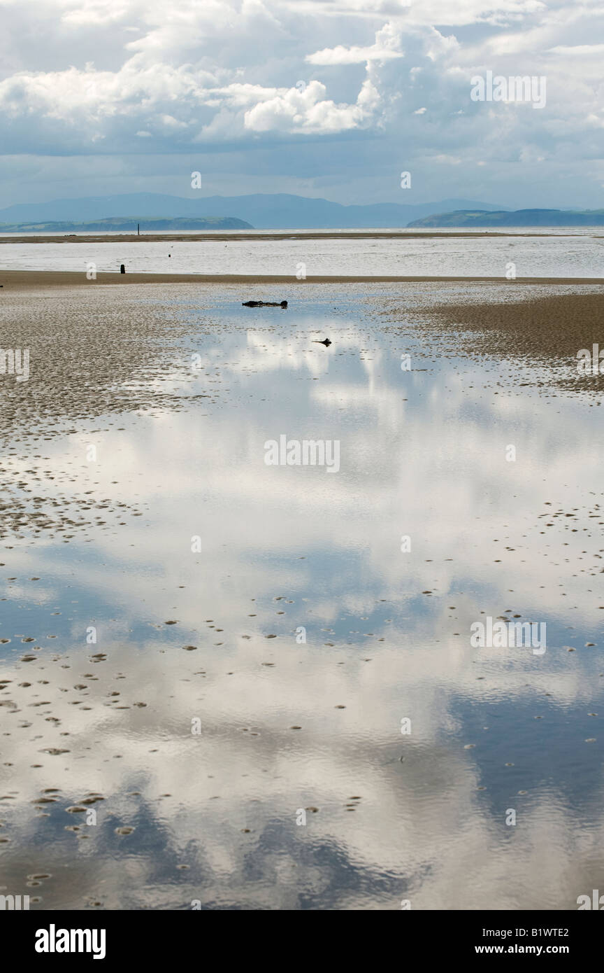 Storm clouds reflected in seawater over Findhorn beach, Moray, Scotland Stock Photo