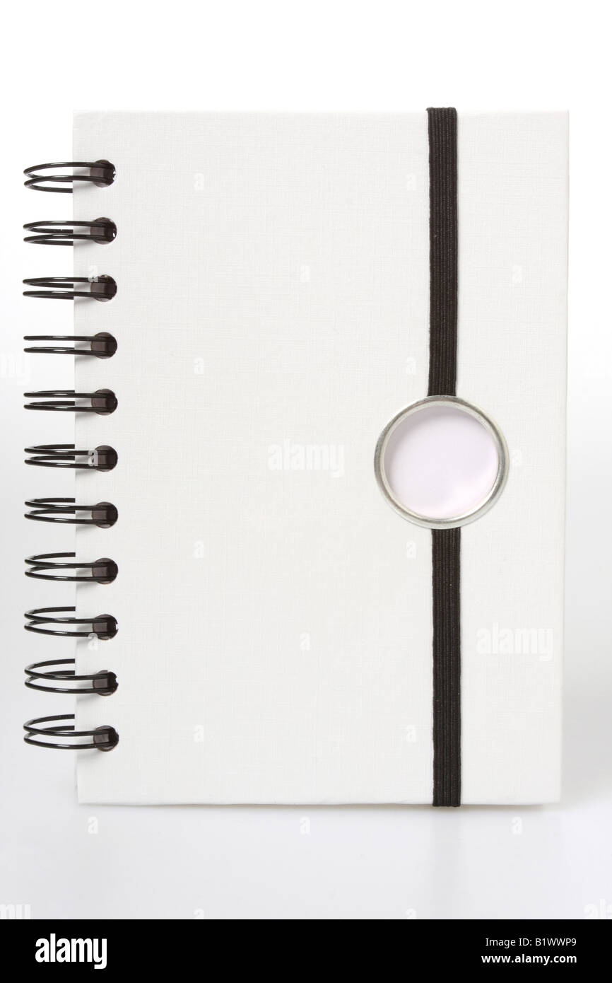 White notebook with black ring binders isolated on white black string to hold it closed Stock