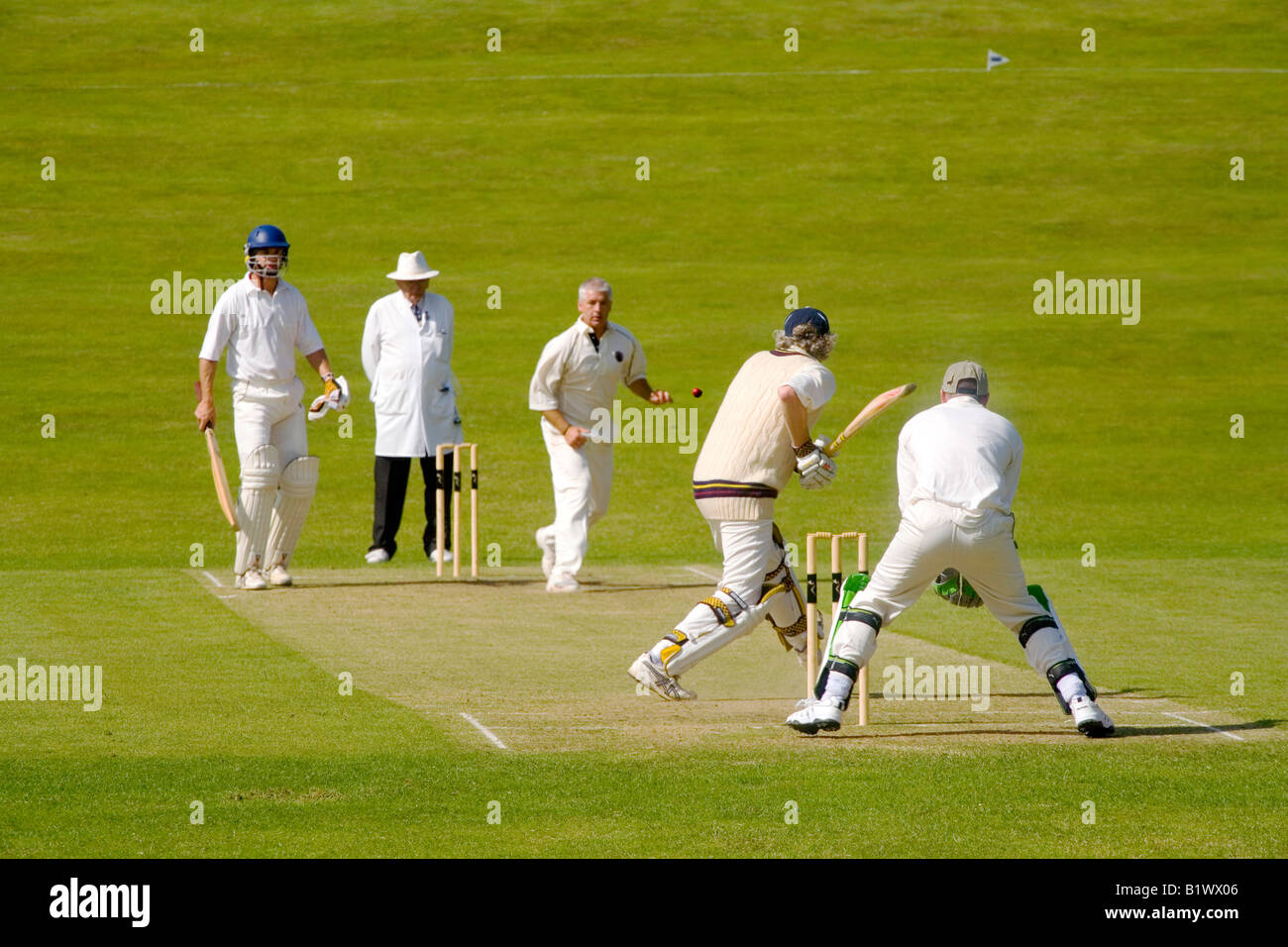 English Cricket match in Village in Surrey Stock Photo