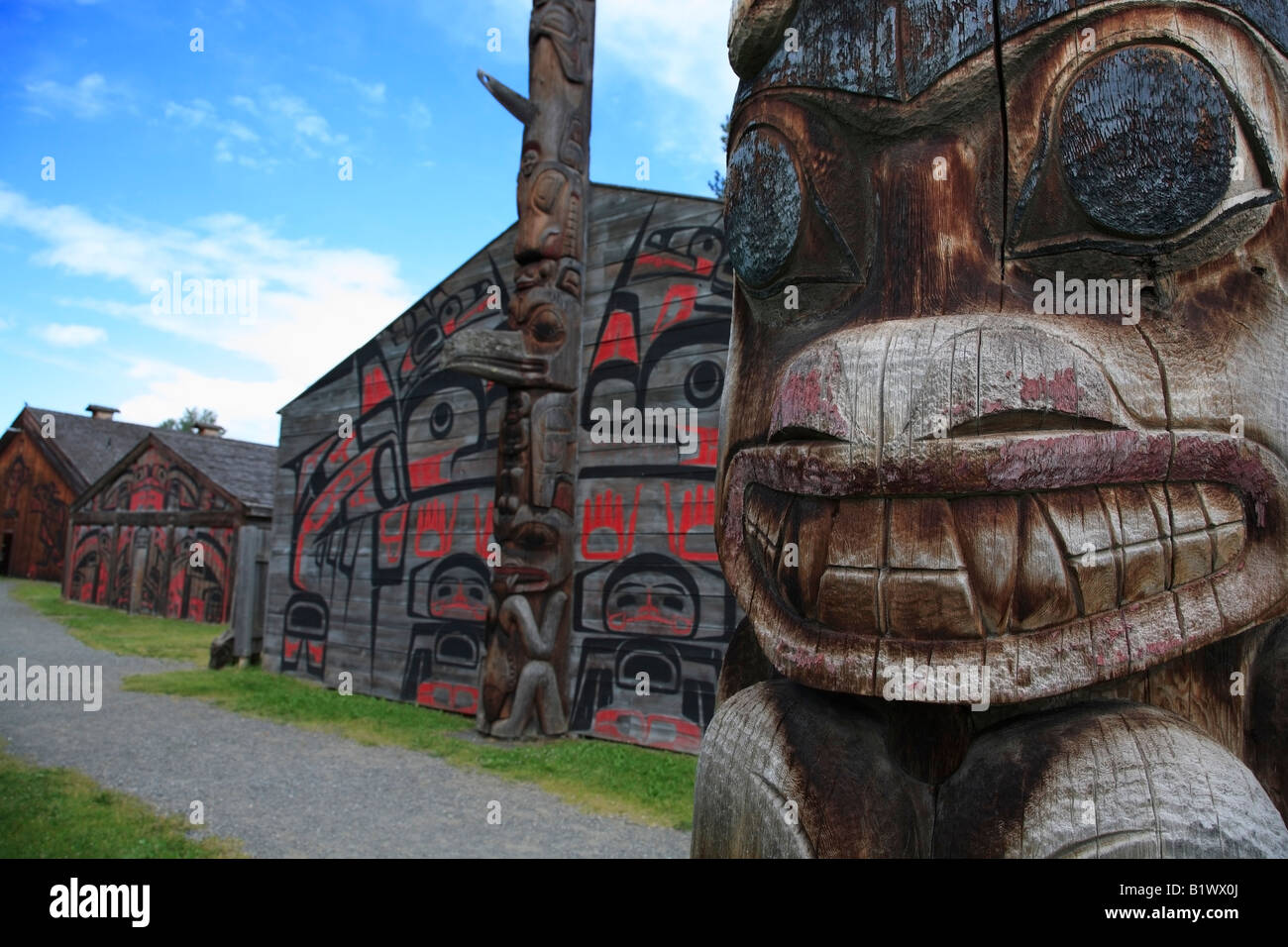 Detail of totem pole and longhouses Ksan Historical Village and Museum Hazelton British Columbia Stock Photo