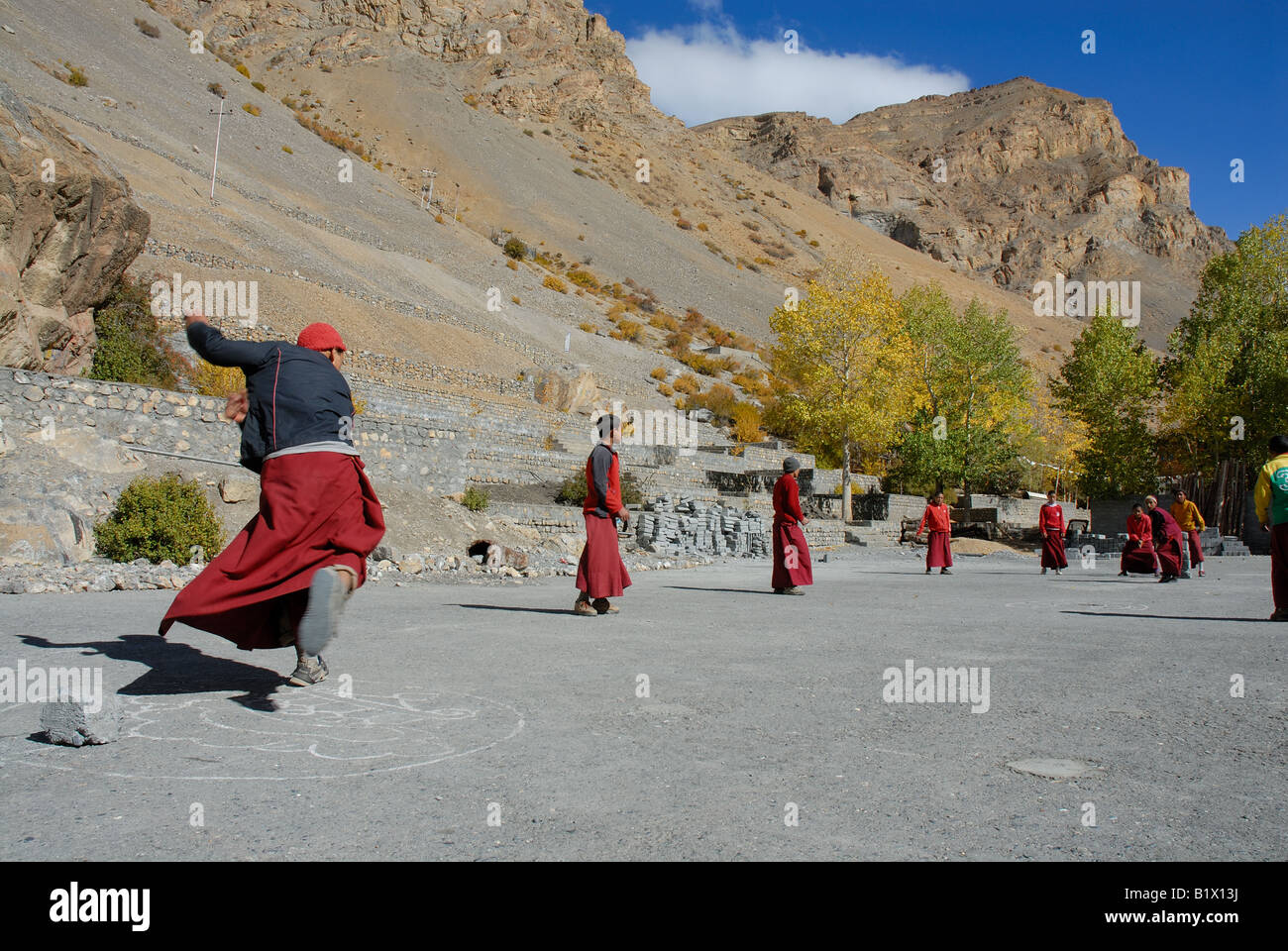 Young Buddhist monks lamas playing a game of cricket at Ki monastery’s complex. Stock Photo
