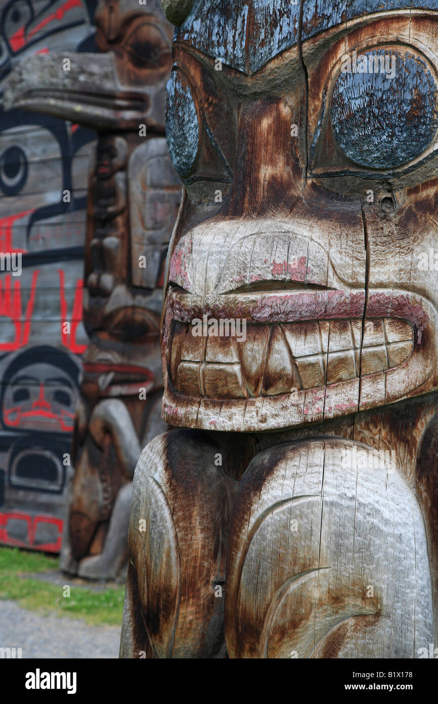 Detail of totem pole and longhouse Ksan Historical Village and Museum Hazelton British Columbia Stock Photo