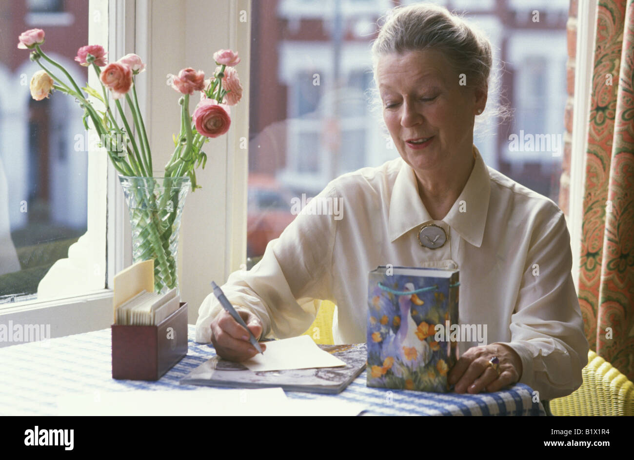 elderly woman writing a letter Stock Photo - Alamy