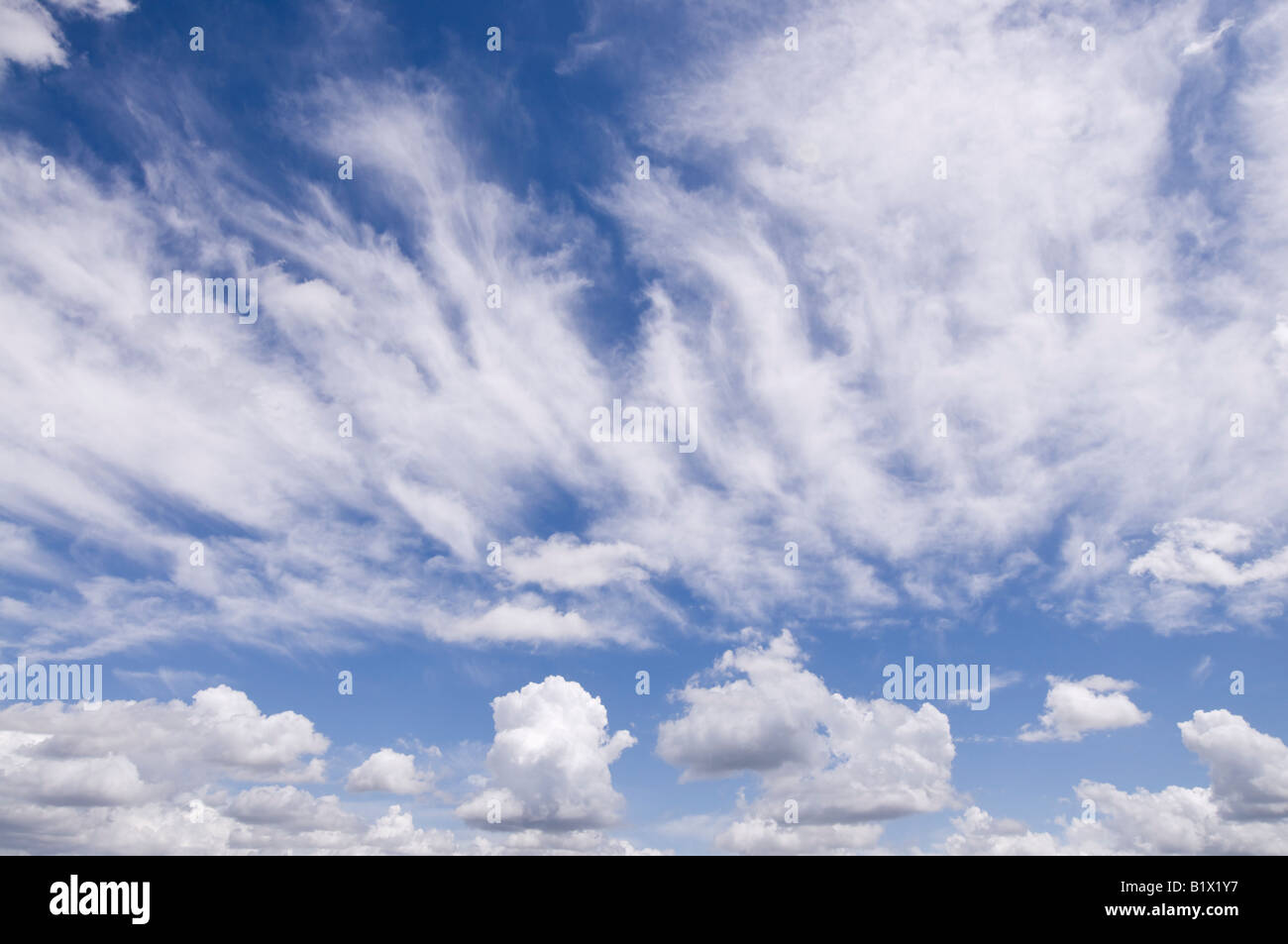 Cumulus and Cirrus clouds, France. Stock Photo