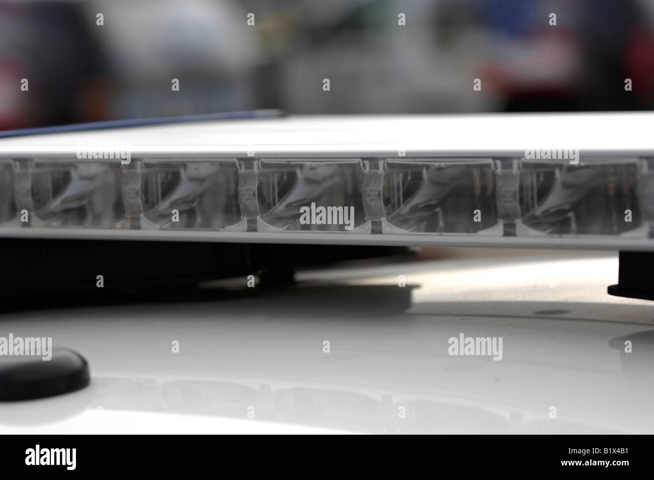 Siren and light bar atop a law enforcement police cruiser vehicle Stock