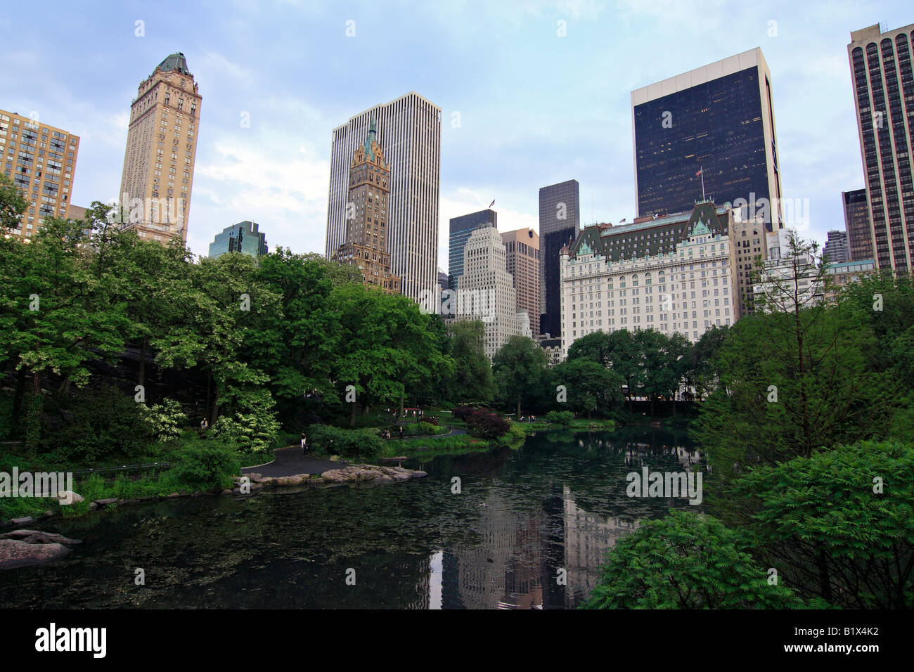 Manhattan buildings reflecting in The Pond - Central Park, New York City, USA Stock Photo