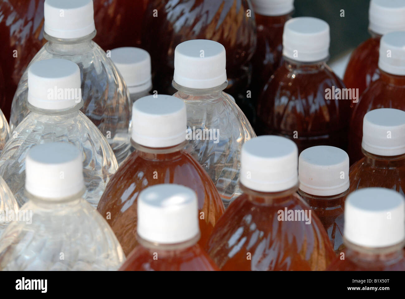 Olive oil in plastic bottles for sale in a booth along the road near