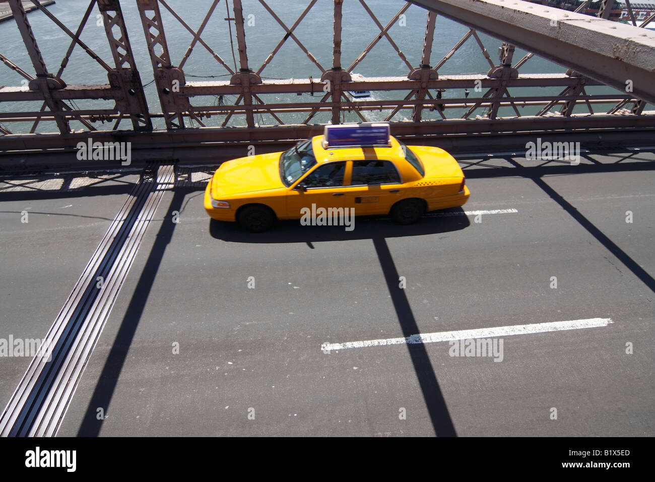 Yellow taxi on Brooklyn bridge - New York City, USA Stock Photo