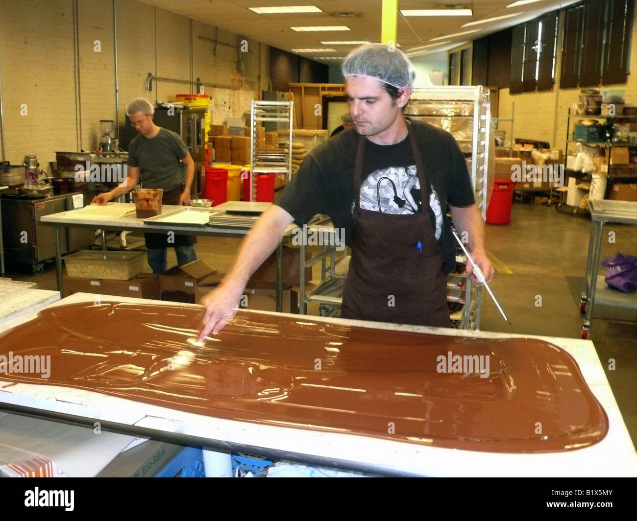 Seattle, Theo Chocolate Factory, "tempering" chocolate on marble slab
