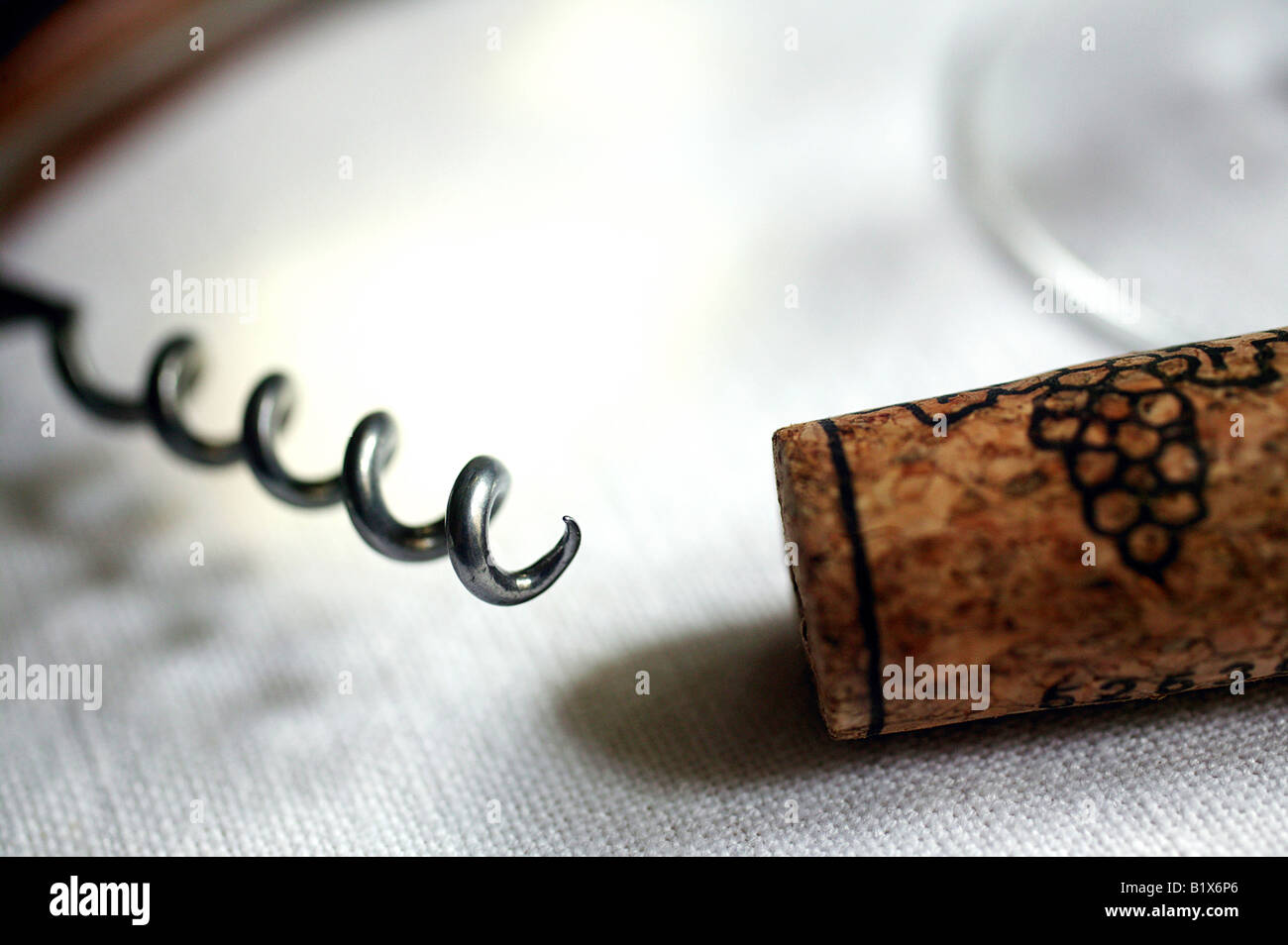 Glass of white wine with corkscrew and cork Stock Photo Alamy