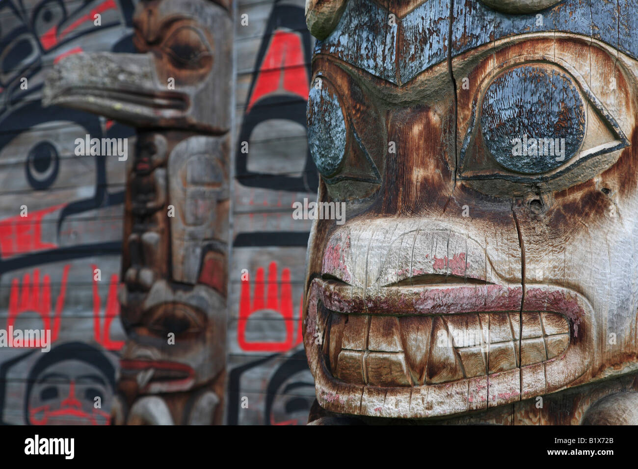 Detail of totem pole and longhouse Ksan Historical Village and Museum Hazelton British Columbia Stock Photo
