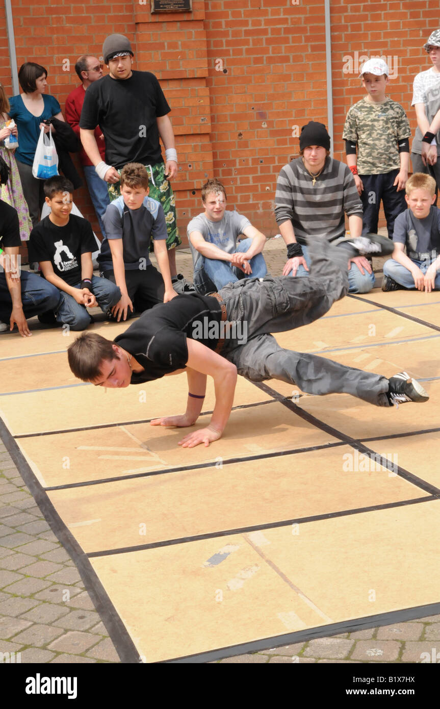 Breakdancers being watched by crowd in Derbyshire England Stock Photo