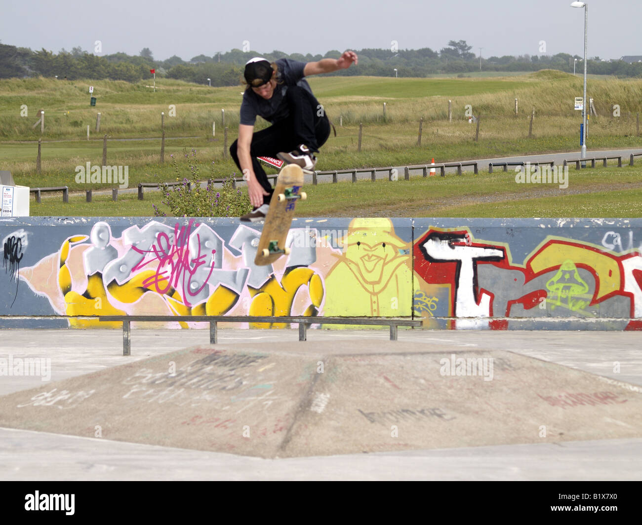 skateboarder in the air after jumping a ramp Stock Photo Alamy