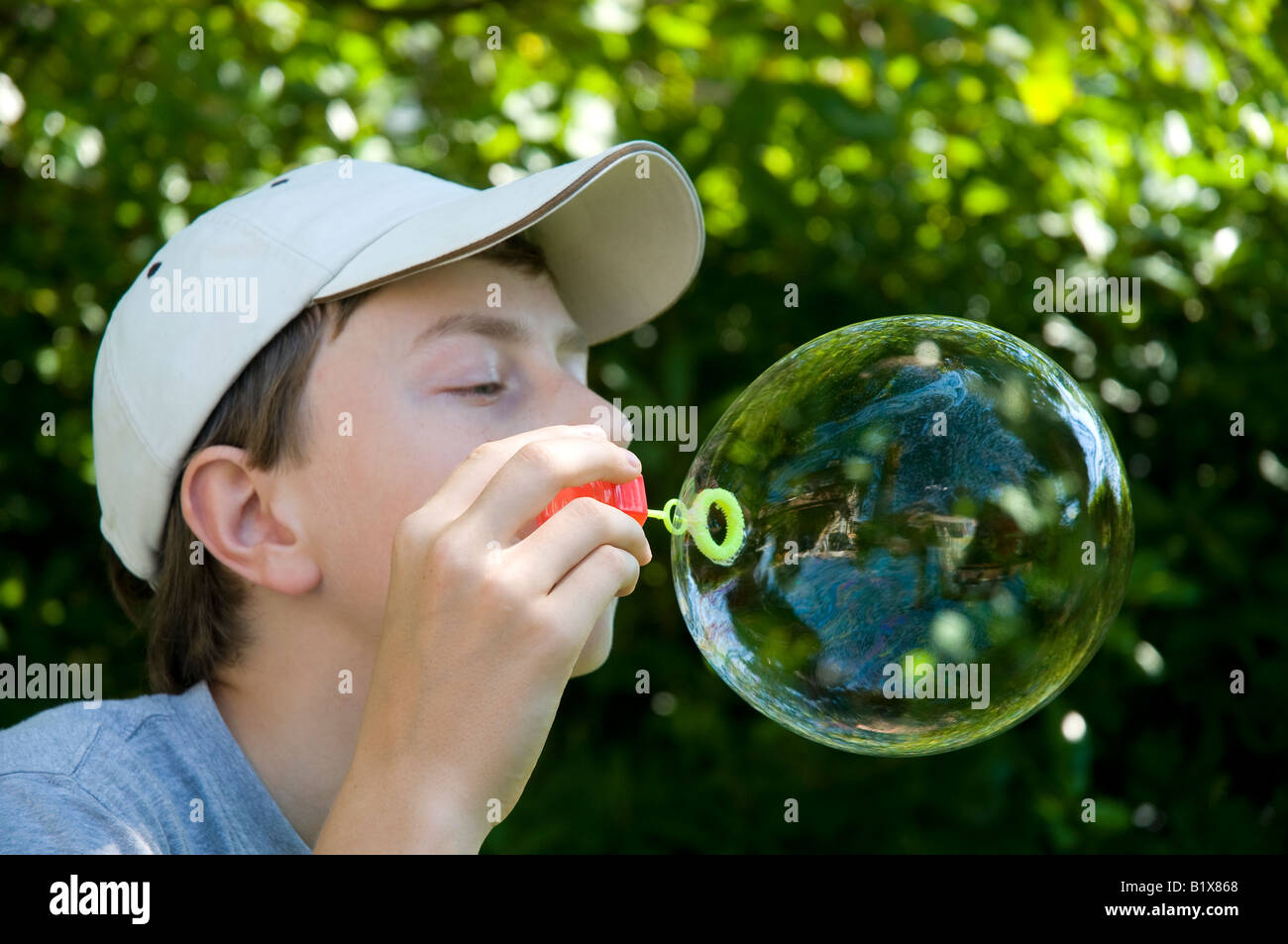 a child playing with soap bubbles Stock Photo - Alamy