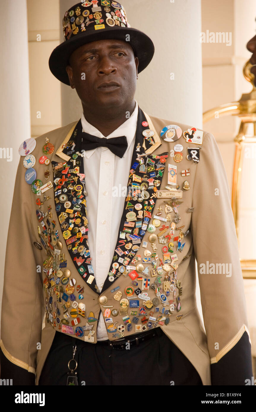 Doorman of Hotel Polana adorned with multiple badges of international