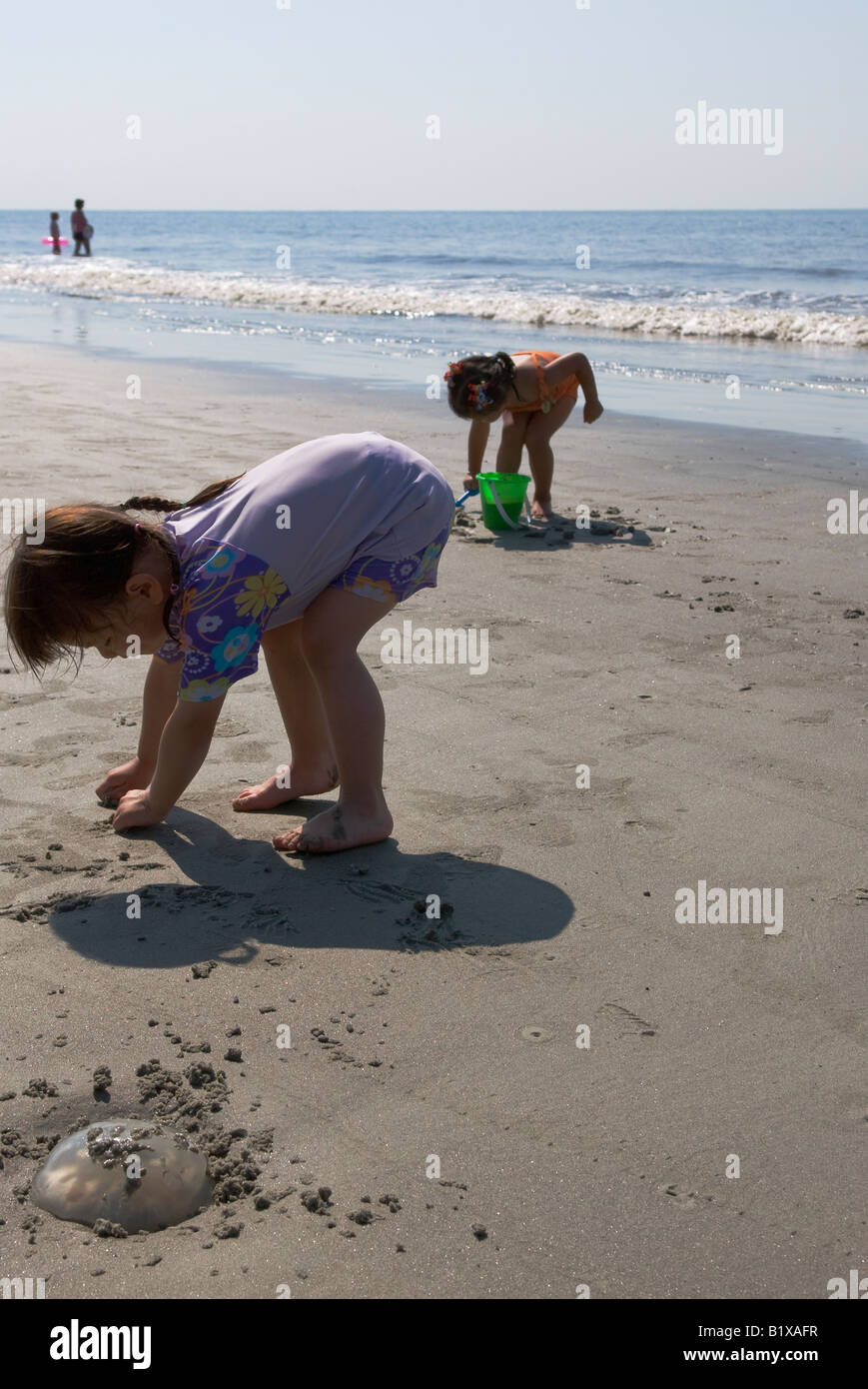 little asian girl playing on the beach Stock Photo