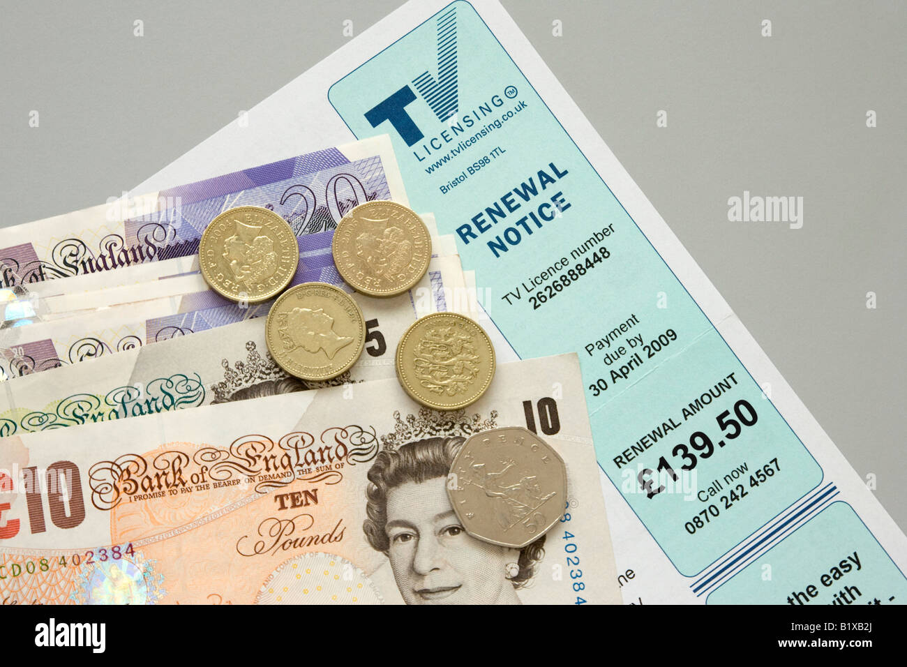 A television licence application form with cash to pay for it Stock Photo