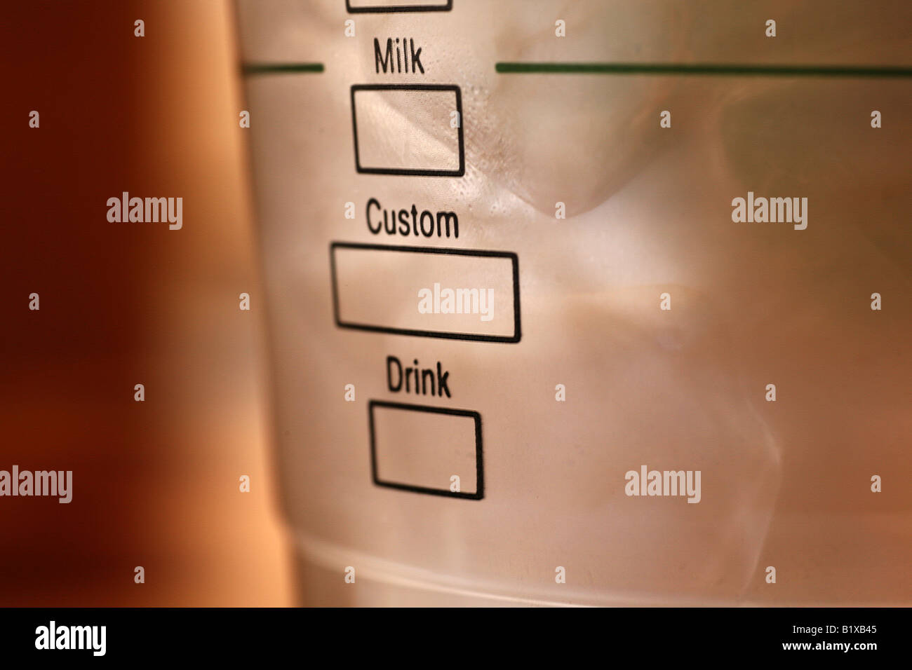 Custom drink served in a plastic cup. Can digitally tick either of the boxes. Coffee culture. Stock Photo