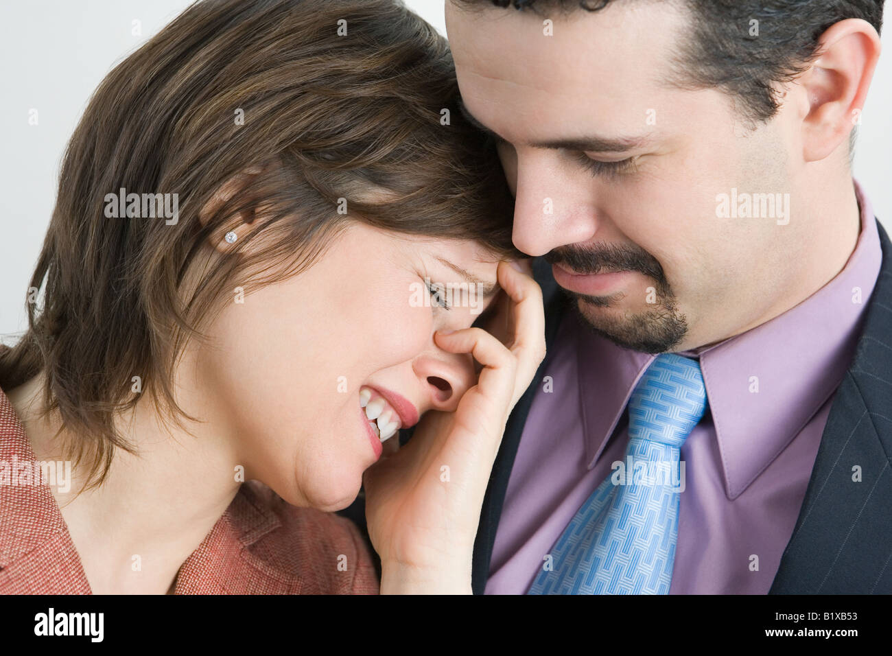 Businessman consoling a businesswoman Stock Photo - Alamy