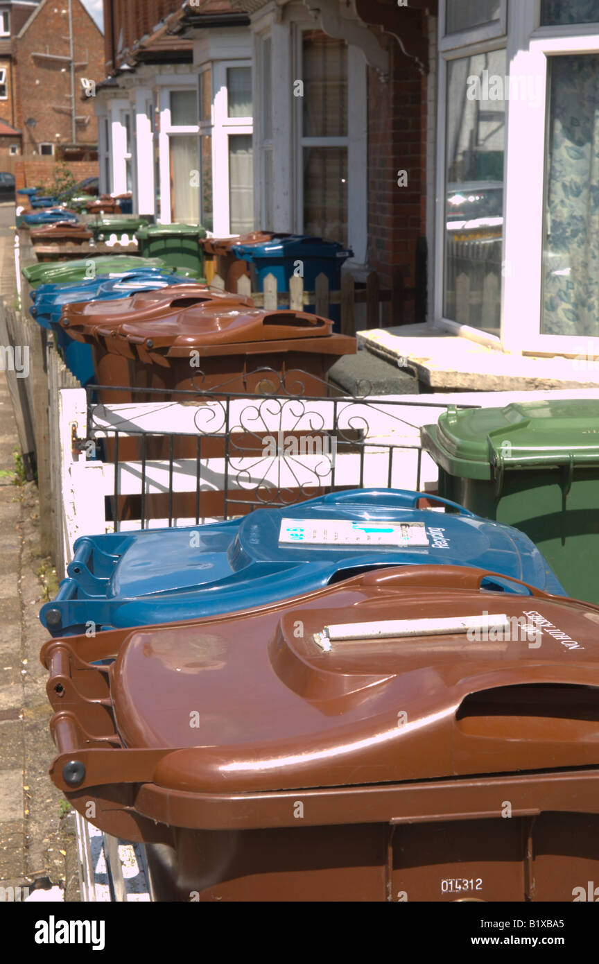 Recycling and waste bins on a crowded terrace in Harrow, London, UK 2/2