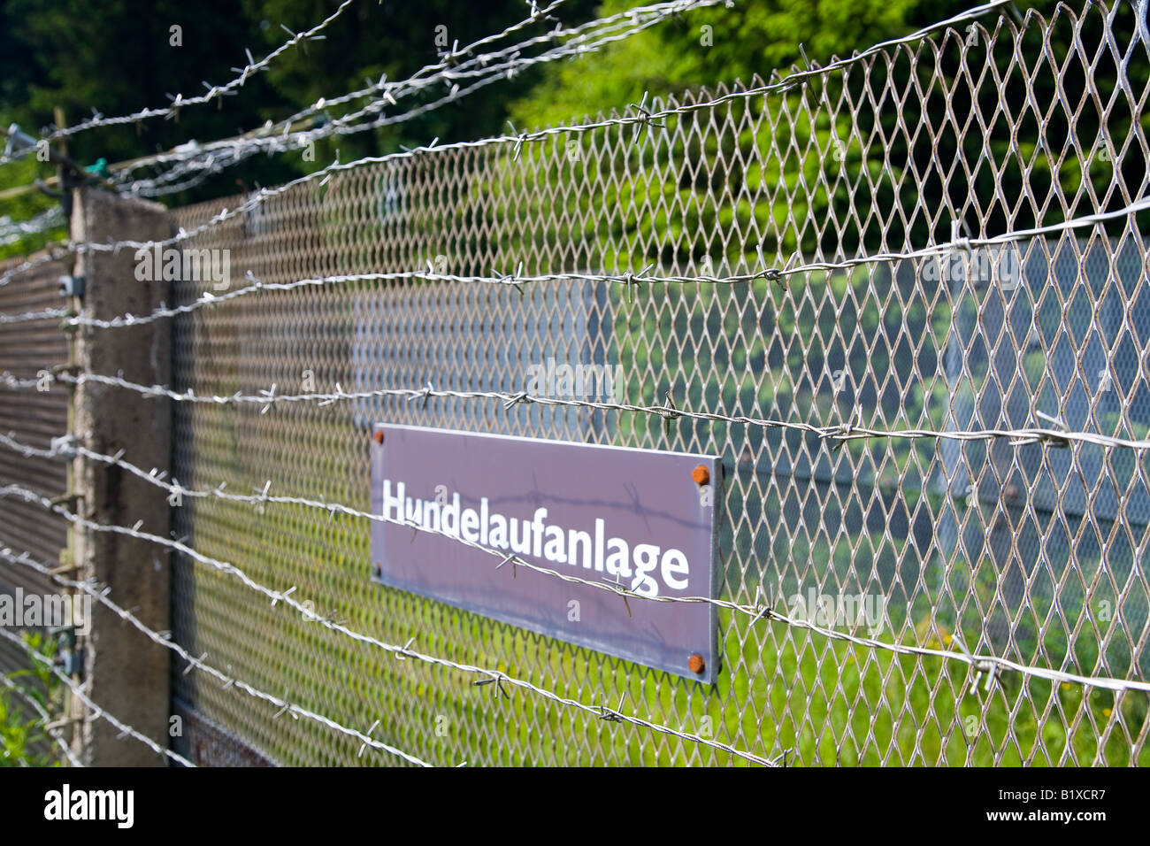 Preserved fence on the old border between east and west Germany at Sorge, Harz, Germany warning of dogs Stock Photo