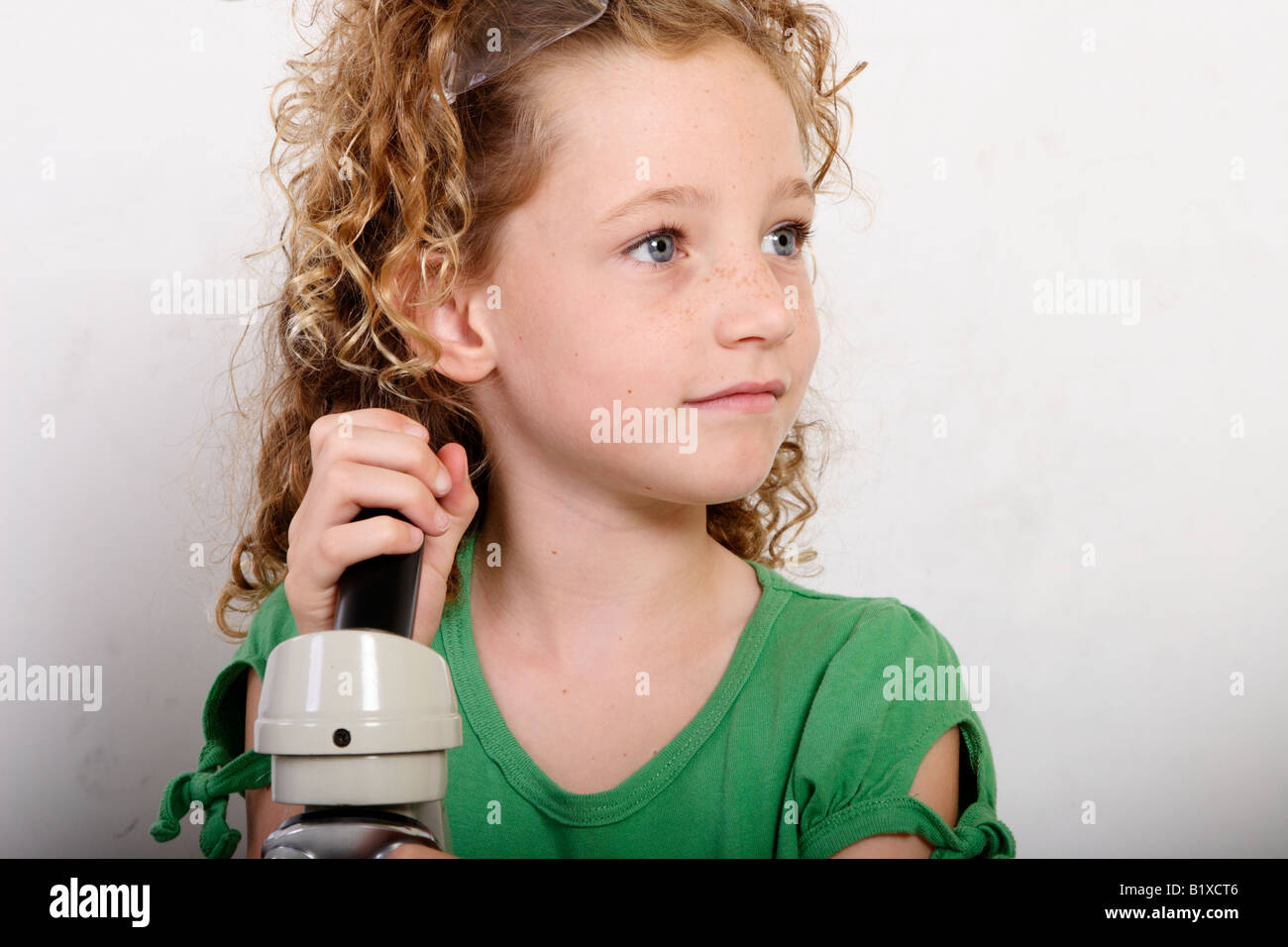Stock Photograph of a student using a microscope Stock Photo