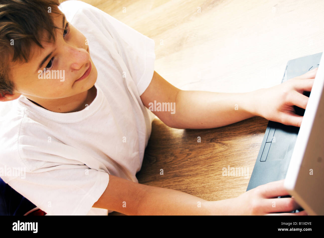 Young boy on laptop Stock Photo