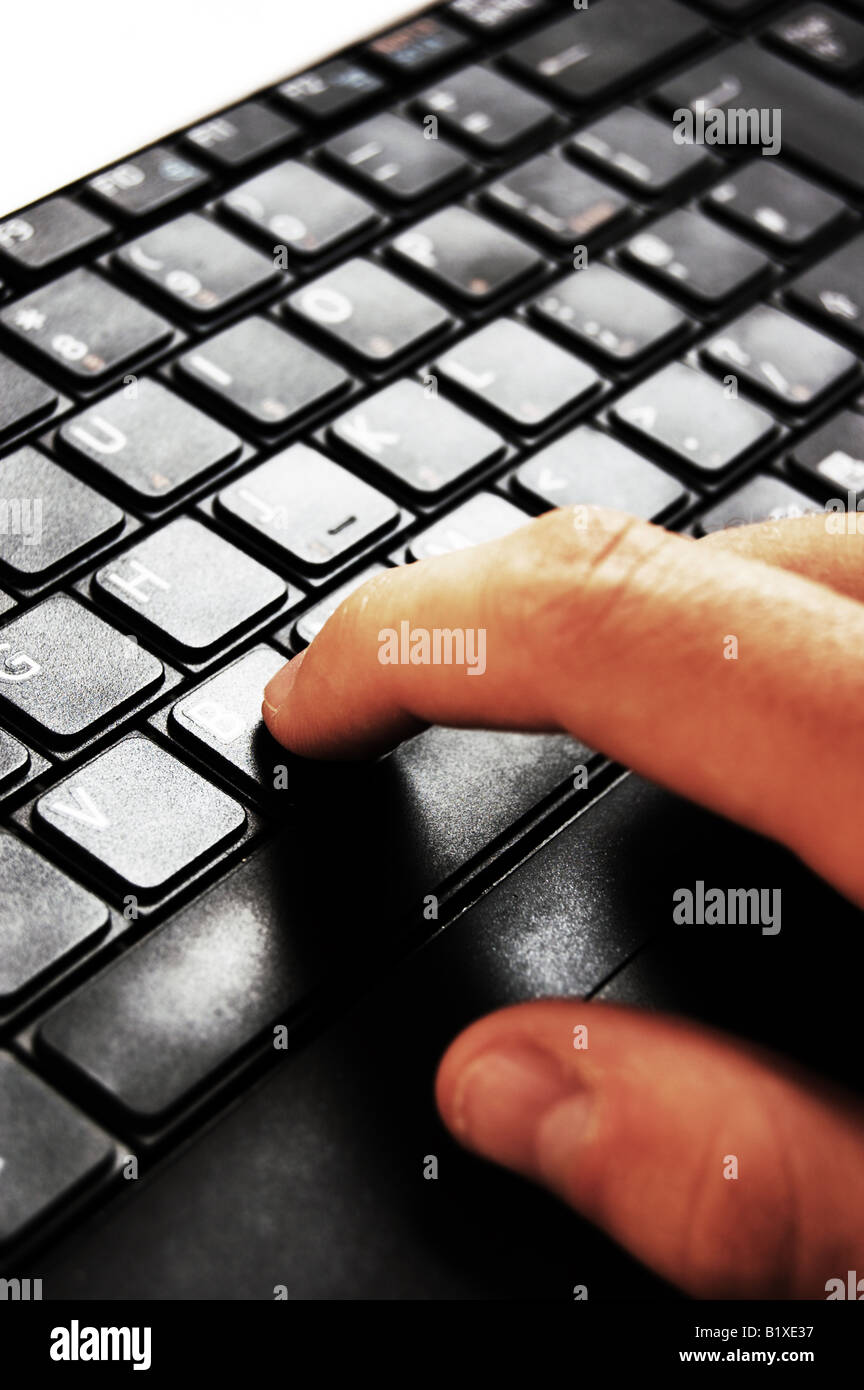 Typing on laptop Stock Photo - Alamy