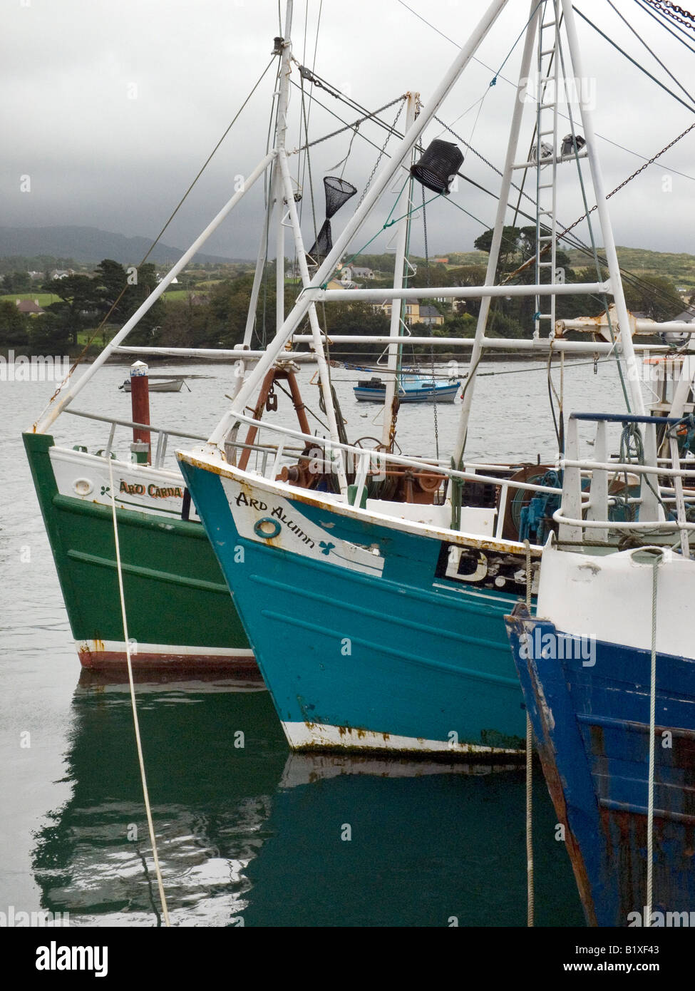 bows of fishing boats moored in Union Hall Harbour West Cork Ireland Stock Photo