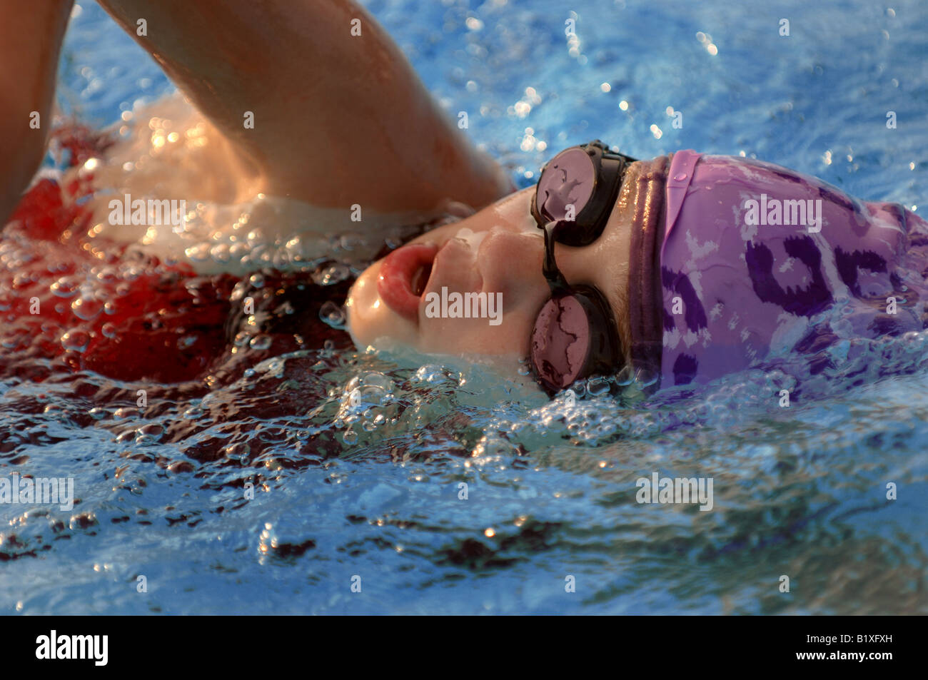 close up of swimmers face swimming free style Stock Photo