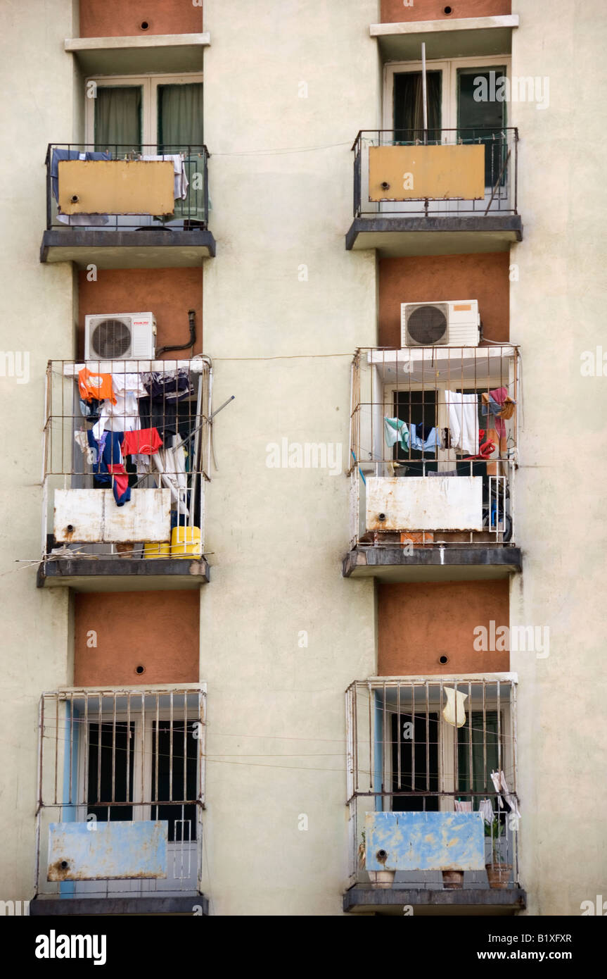 Rows and lines of modified balconies on decayed high rise building ...