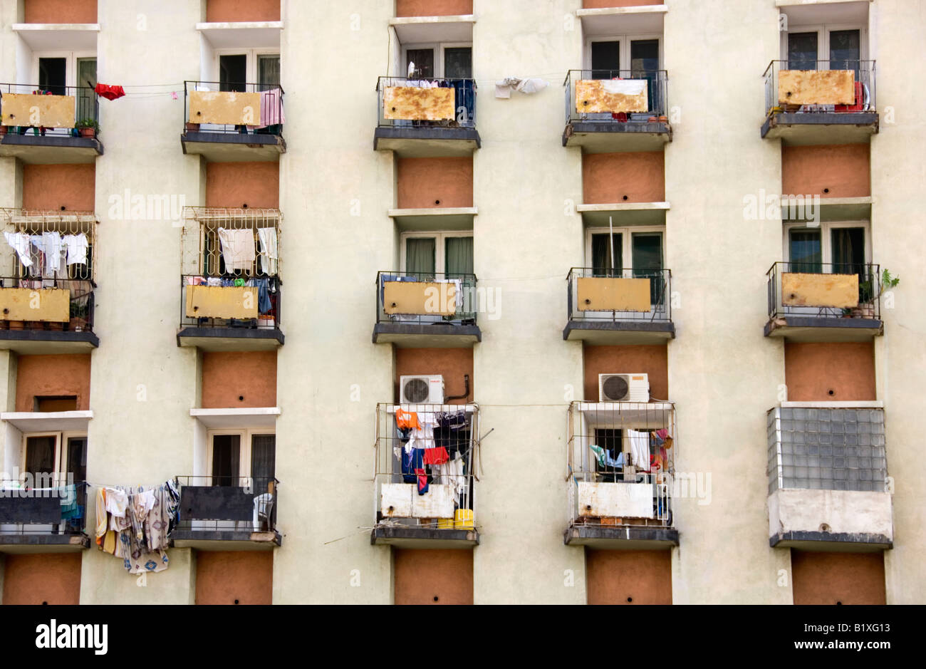 Rows and lines of modified balconies on decayed high rise building ...