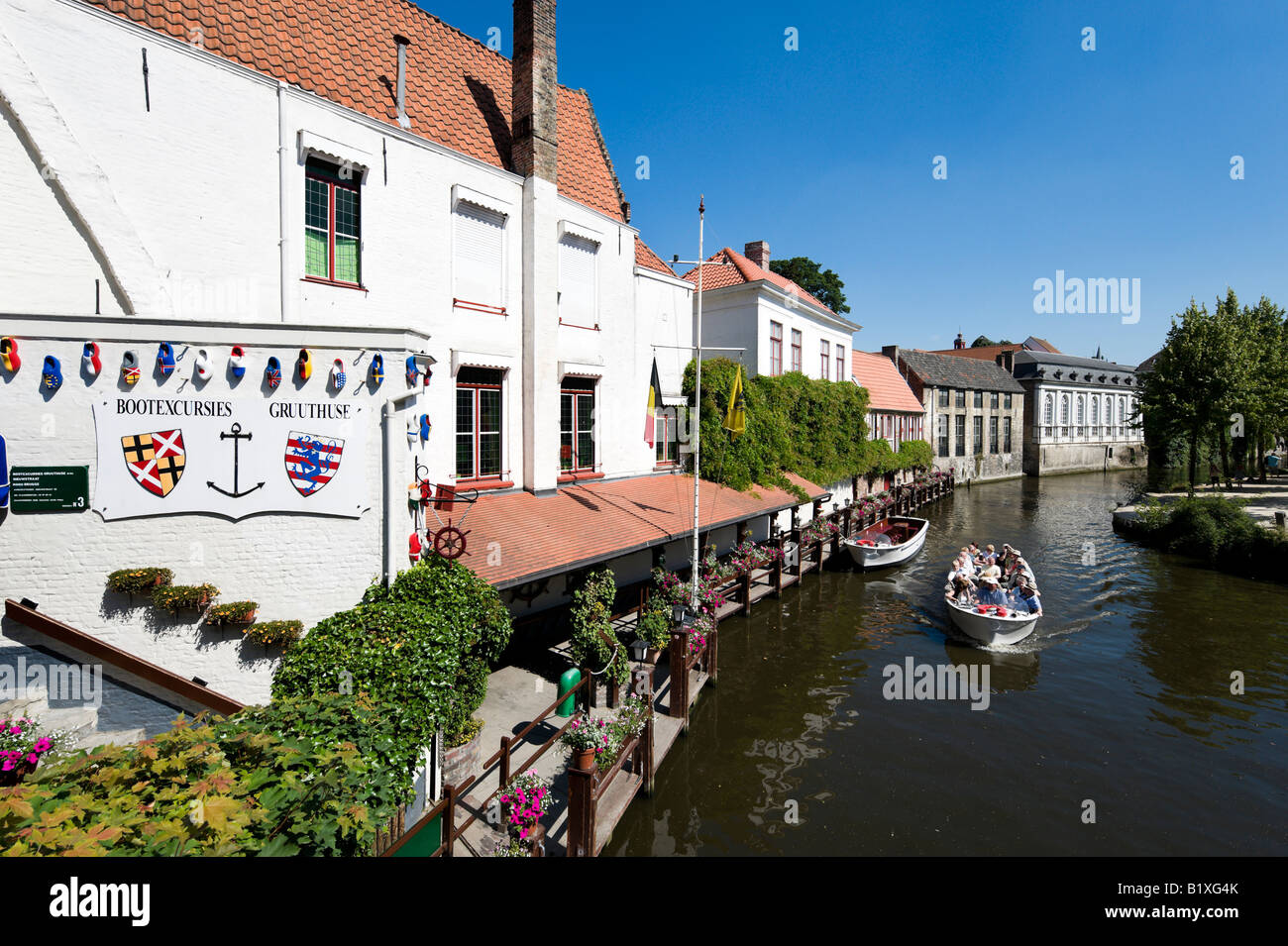 Boat trip on a canal in the old town centre, Bruges, Belgium Stock Photo