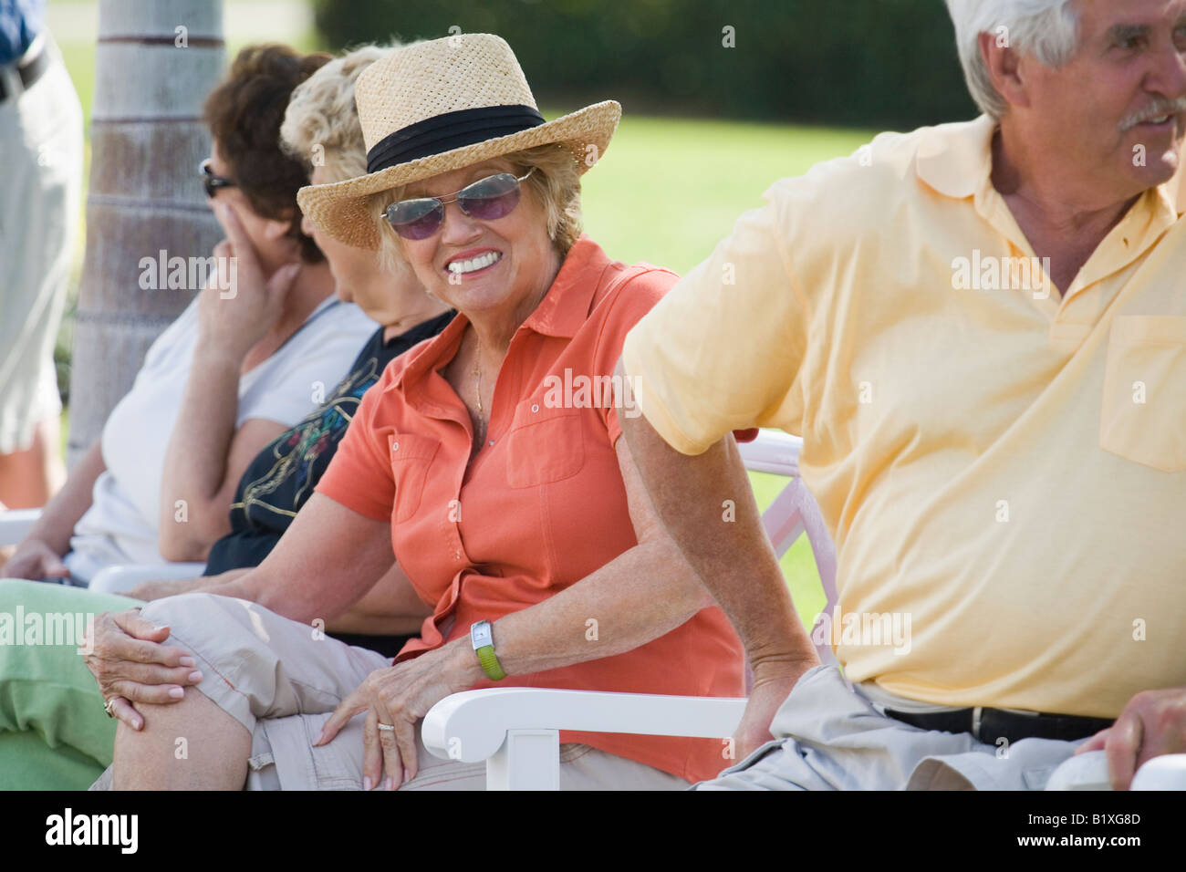 Group of people sitting together Stock Photo - Alamy