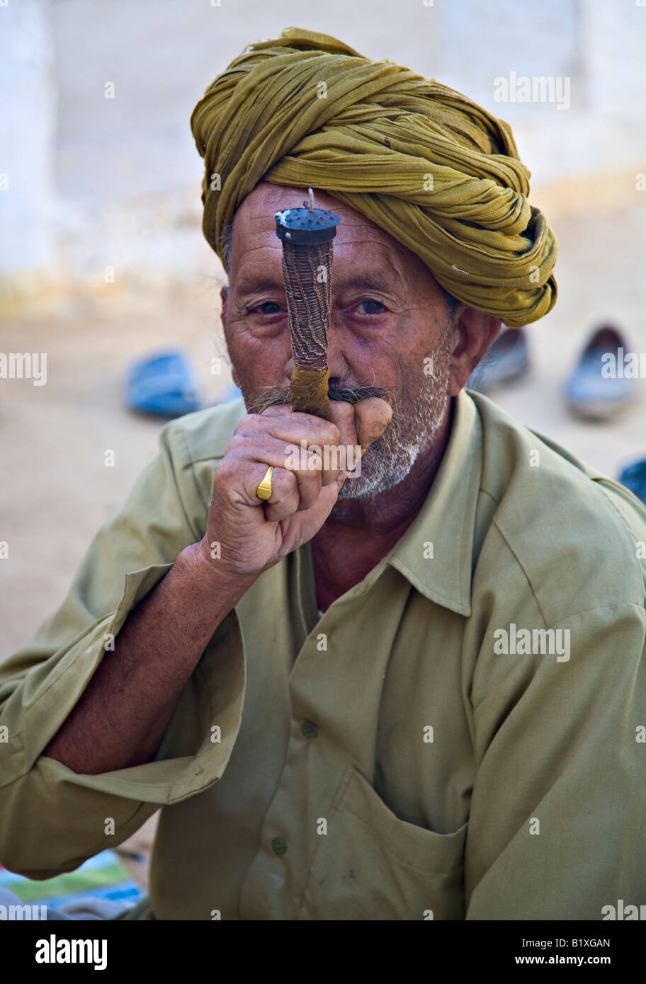 Rajasthani man smoking pipe (Chillum), Thar Desert, India, Asia Stock Photo