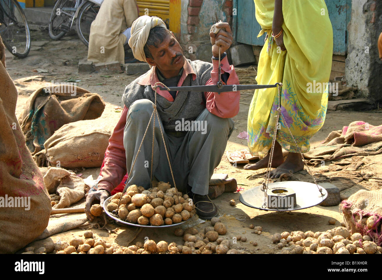 vendor-weighing-potatoes-at-a-vegetable-