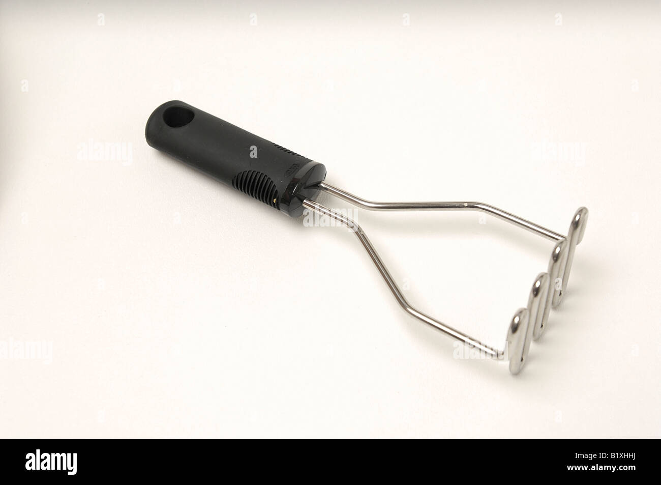 Potato mashing tool Stock Photo Alamy
