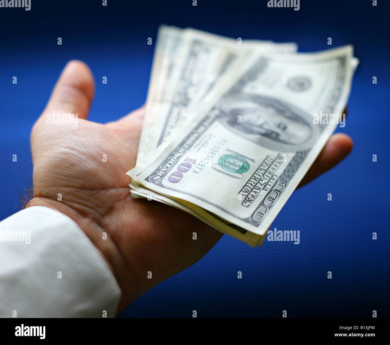 Dollars are in a hand Stock Photo