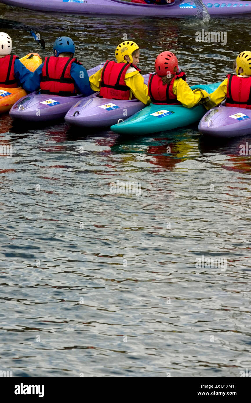 Canoes in a line on Loch Tay Stock Photo Alamy