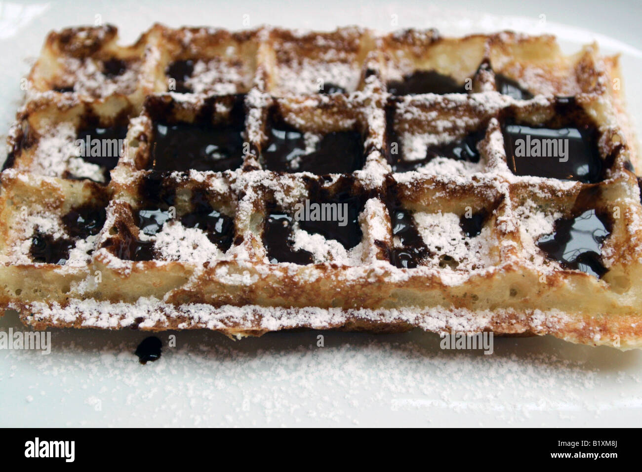 Belgian waffle with chocolate sauce Stock Photo - Alamy