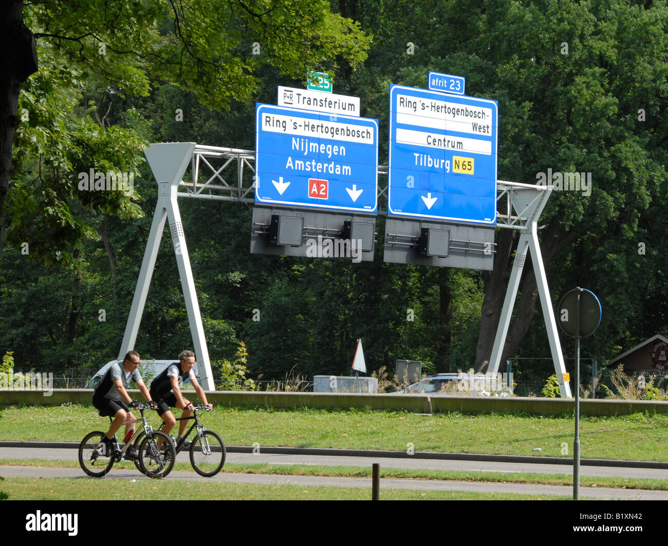 Two bikers, near the highway. Stock Photo