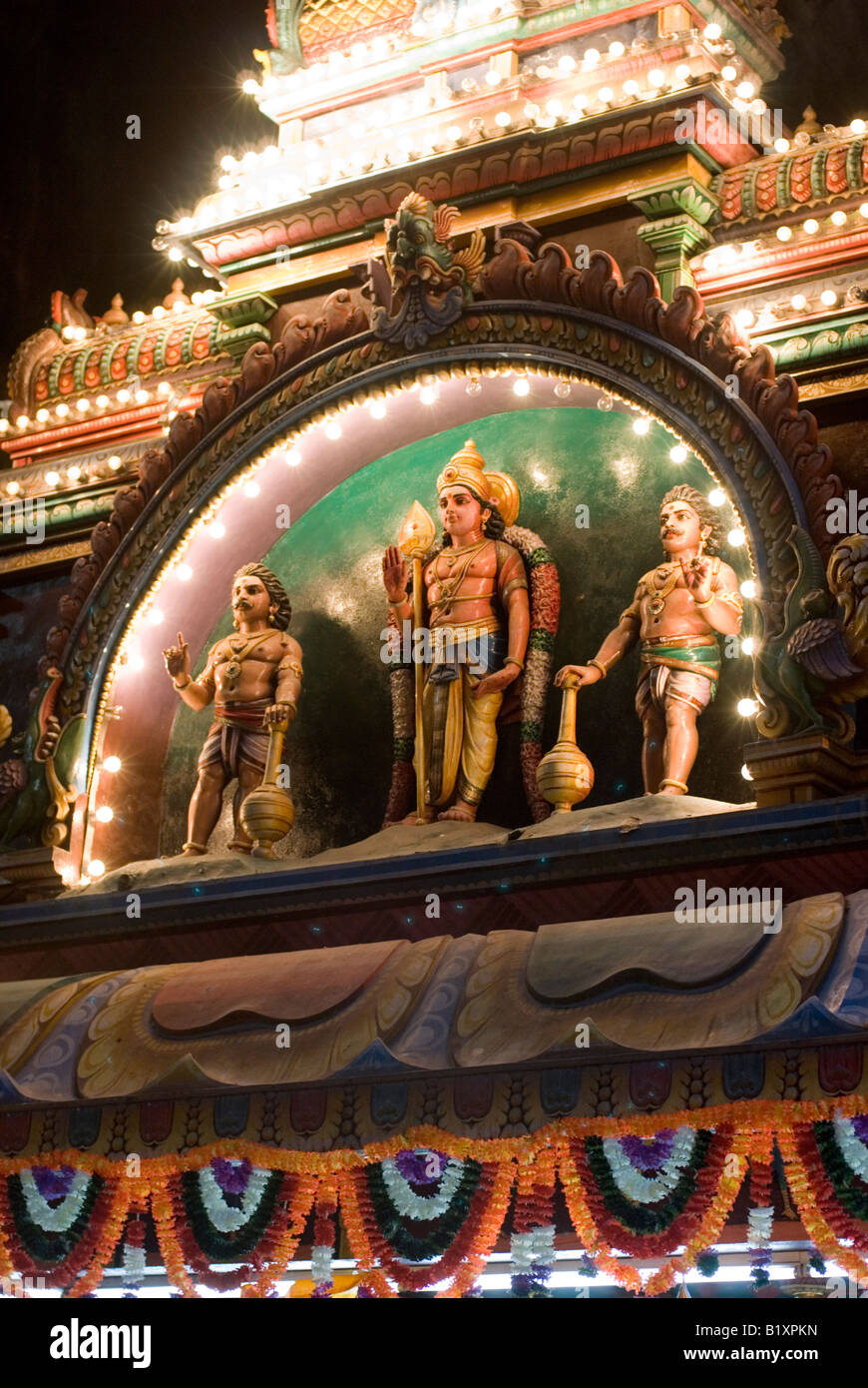 LORD MURUGAN FIGURE ON TEMPLE ROOF DURING ANNUAL HINDU FESTIVAL OF THAIPUSAM BATU CAVES KUALA LUMPUR MALAYSIA Stock Photo