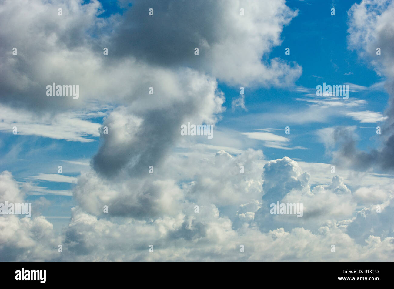 clouds puffy white dark weather sky Stock Photo - Alamy