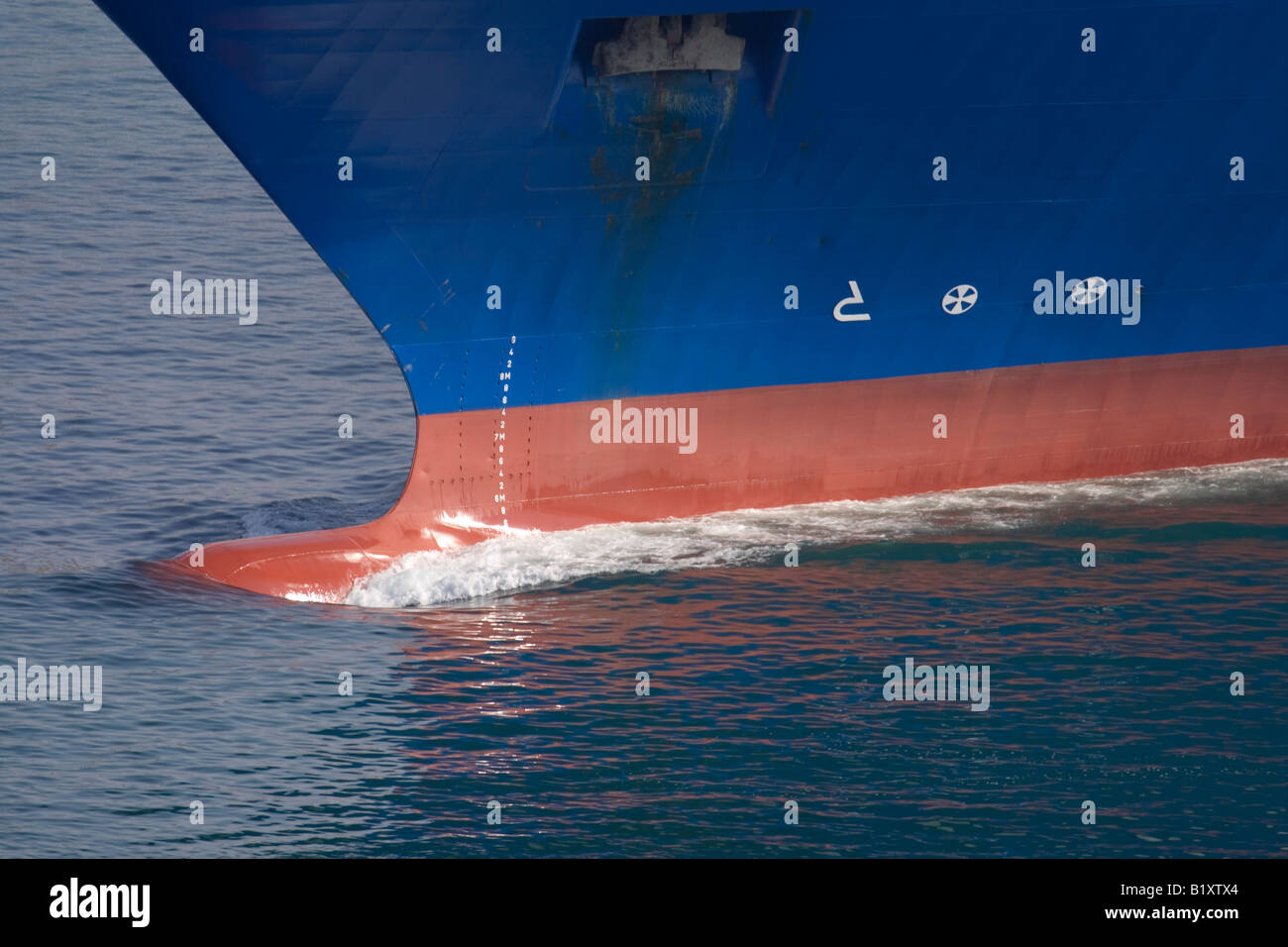 Ship's bow cutting through water Stock Photo