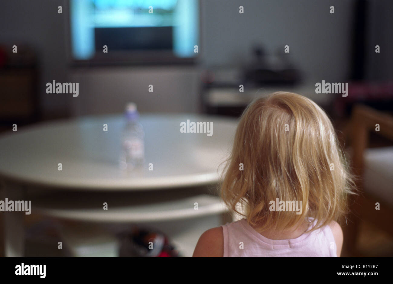 Little girl toddler watching television indoor Stock Photo Alamy