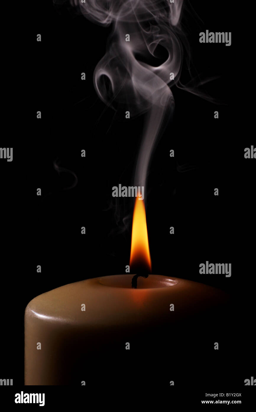 candle flame burning bright and smoke trails Stock Photo Alamy