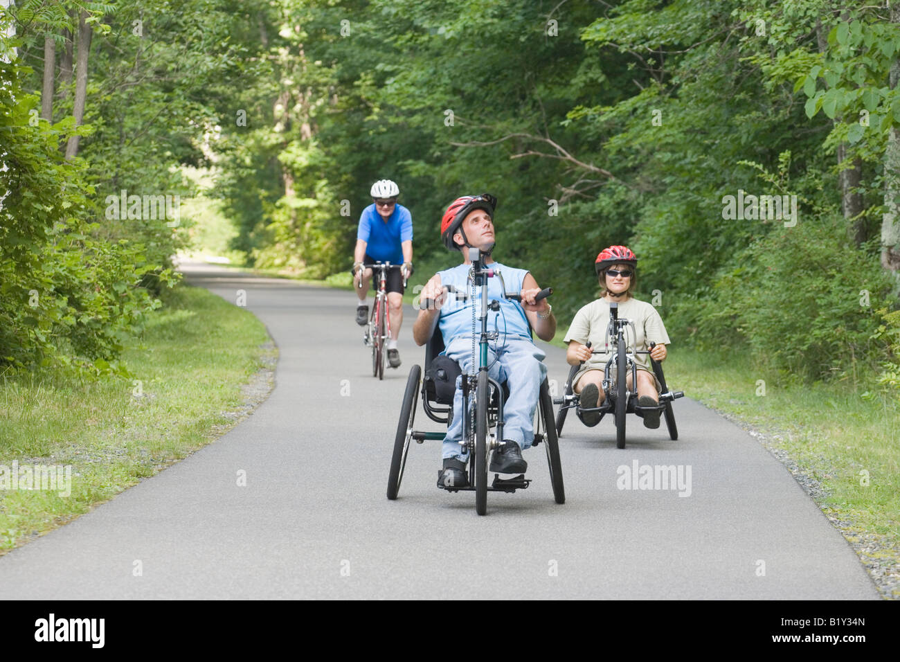 Three friends riding adaptive bikes Stock Photo Alamy